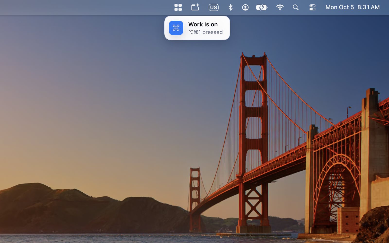A note under the menu bar icon: Work is on, ⌥⌘1 pressed